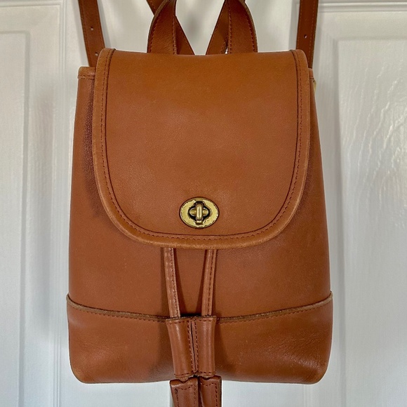 Coach Handbags - Coach vintage smooth leather turnlock, drawstring, small backpack, saddle color